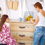 Mother making tea for her ailing daughter